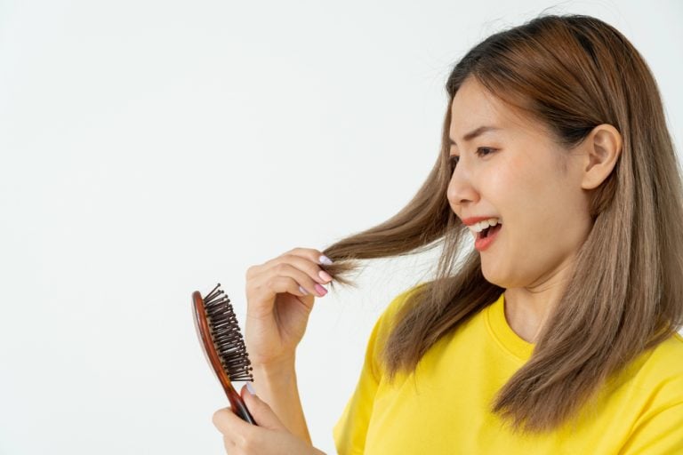 Postpartum Hair Loss: Causes, Timeline & How to Stop Shedding